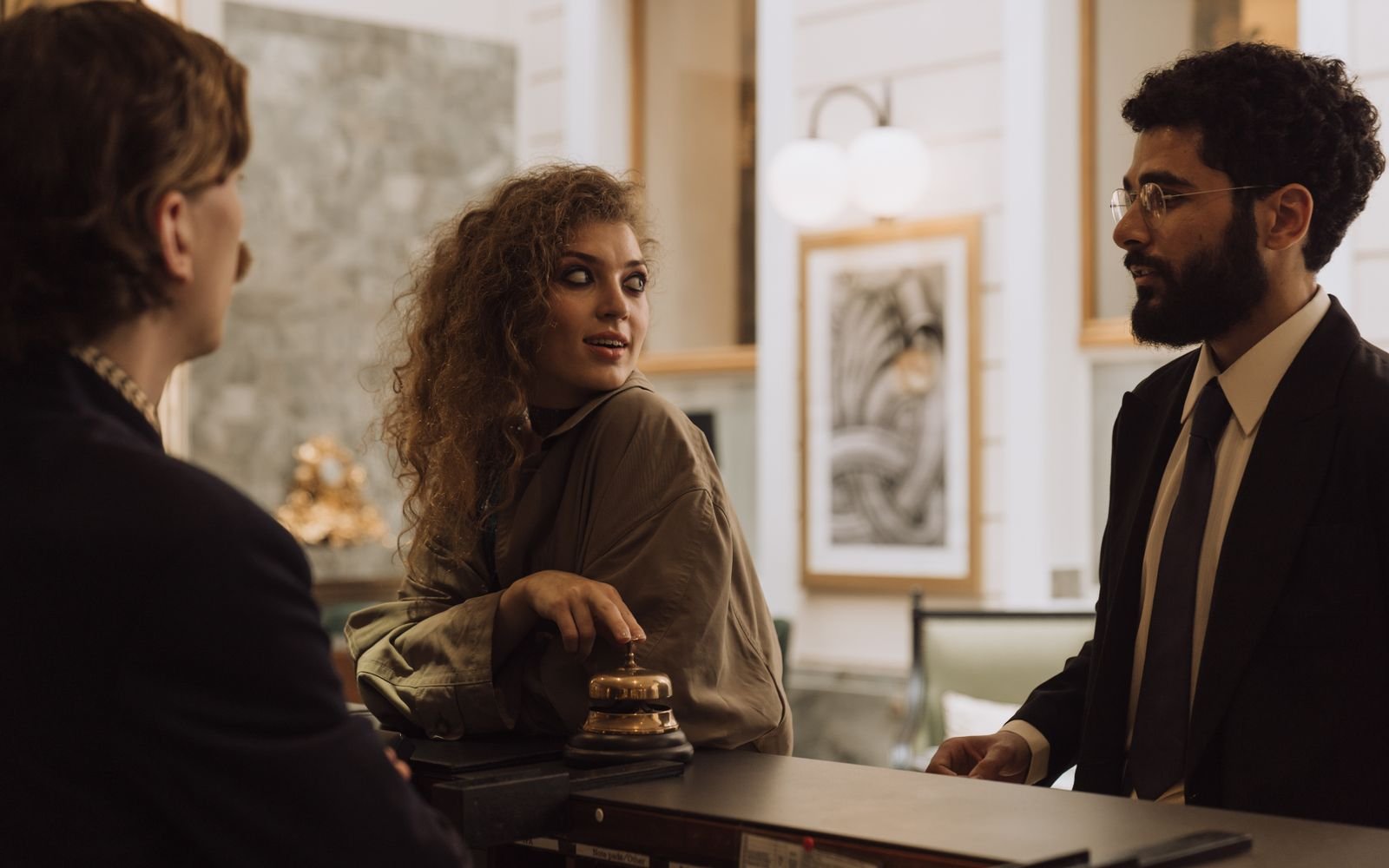 Hotel receptionist assisting a guest