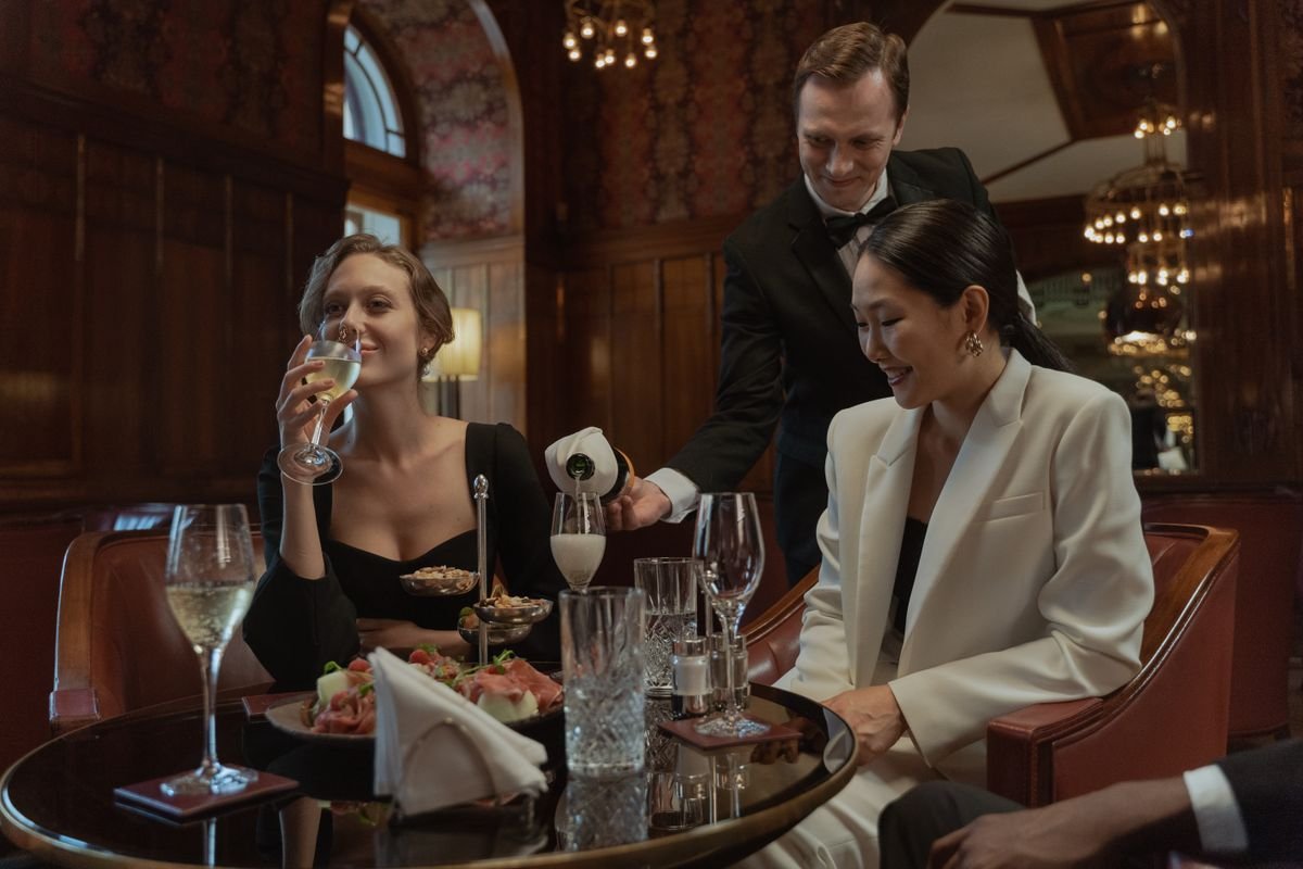 Professional restaurant server setting a table